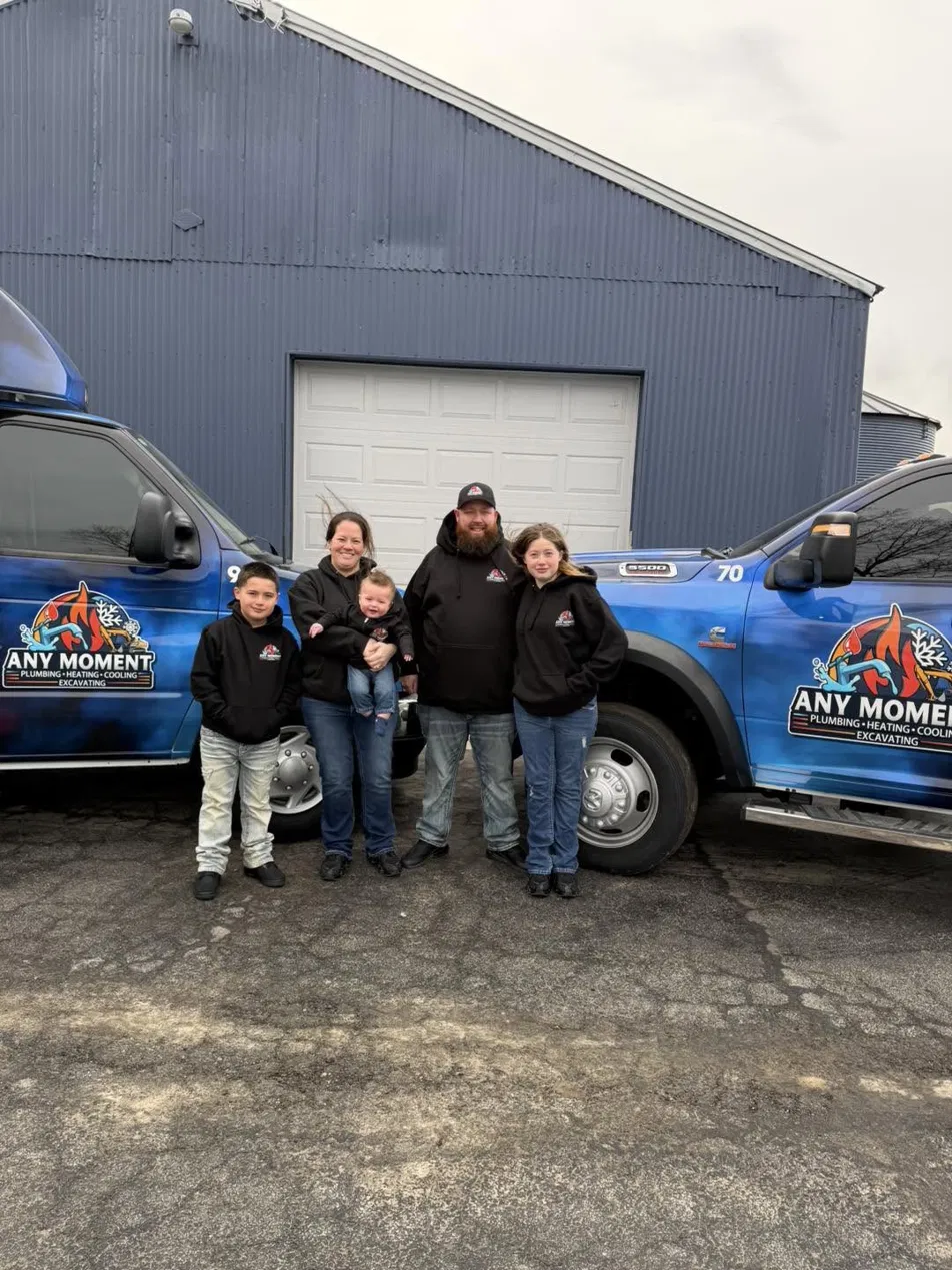 The family behind Any Moment in front of their trucks in Newport, Michigan